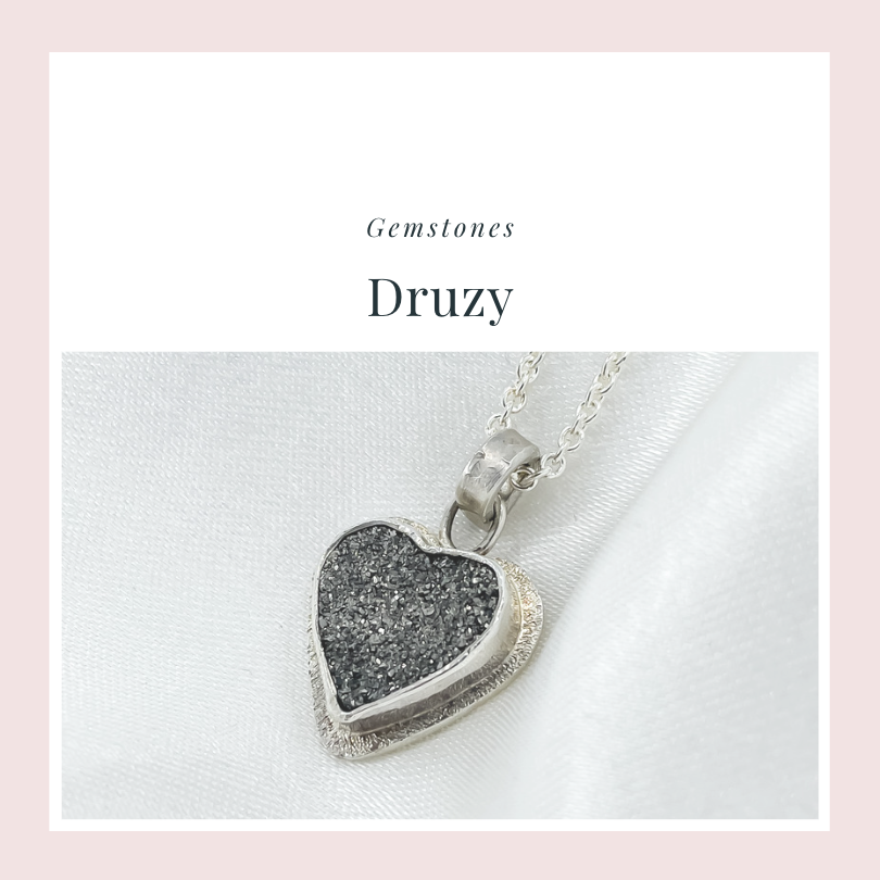 Heart shaped pendant necklace in sterling silver hanging on a cable chain