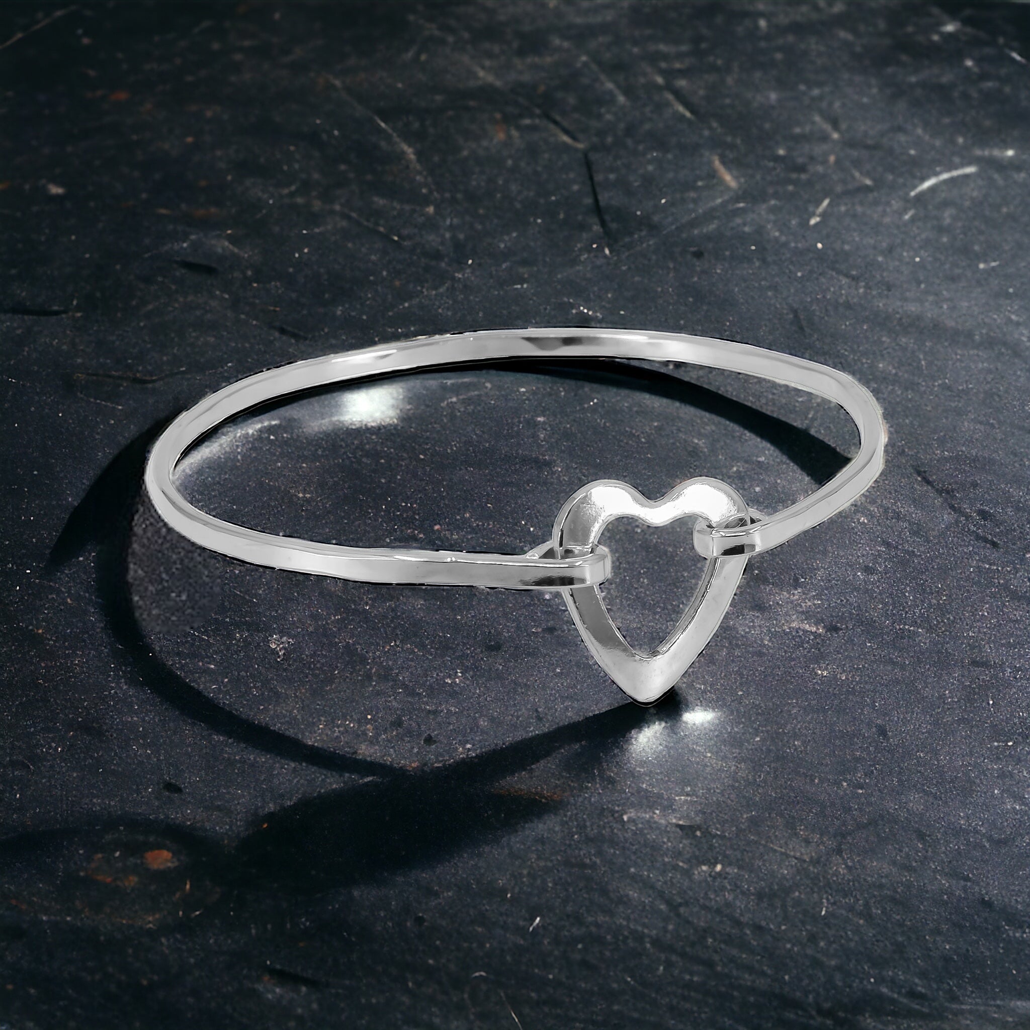 sterling silver open heart bangle bracelet with a hinged closure system