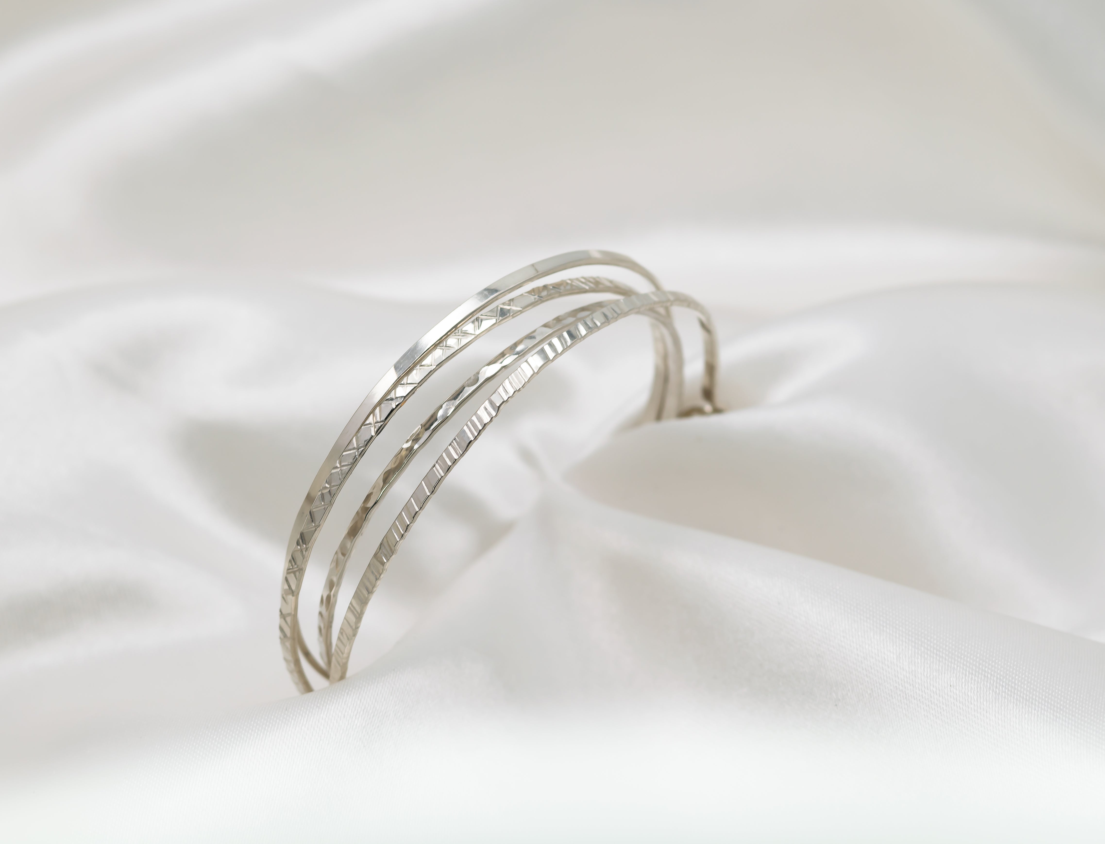 sterling silver stacking bangles with different textures