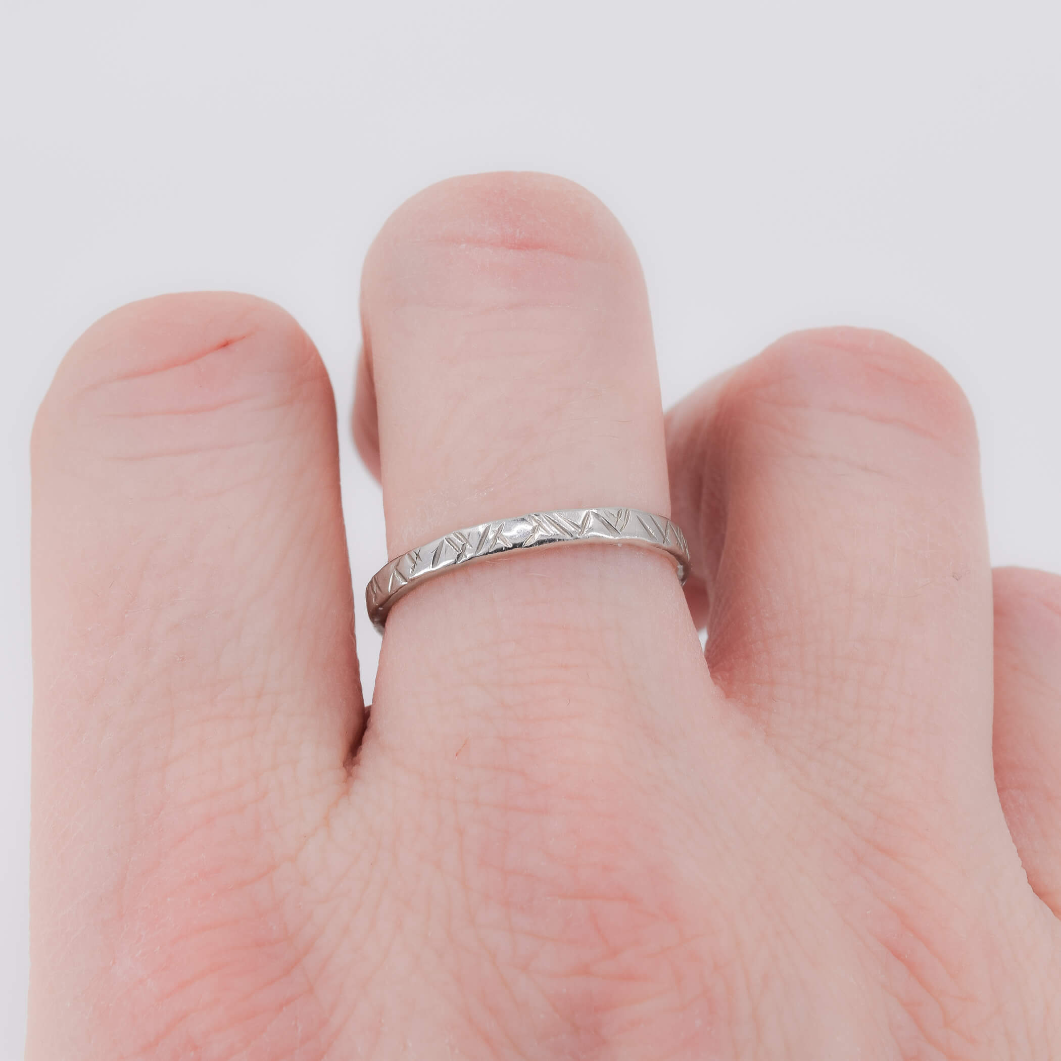 Criss cross textured ring sterling silver shown on finger