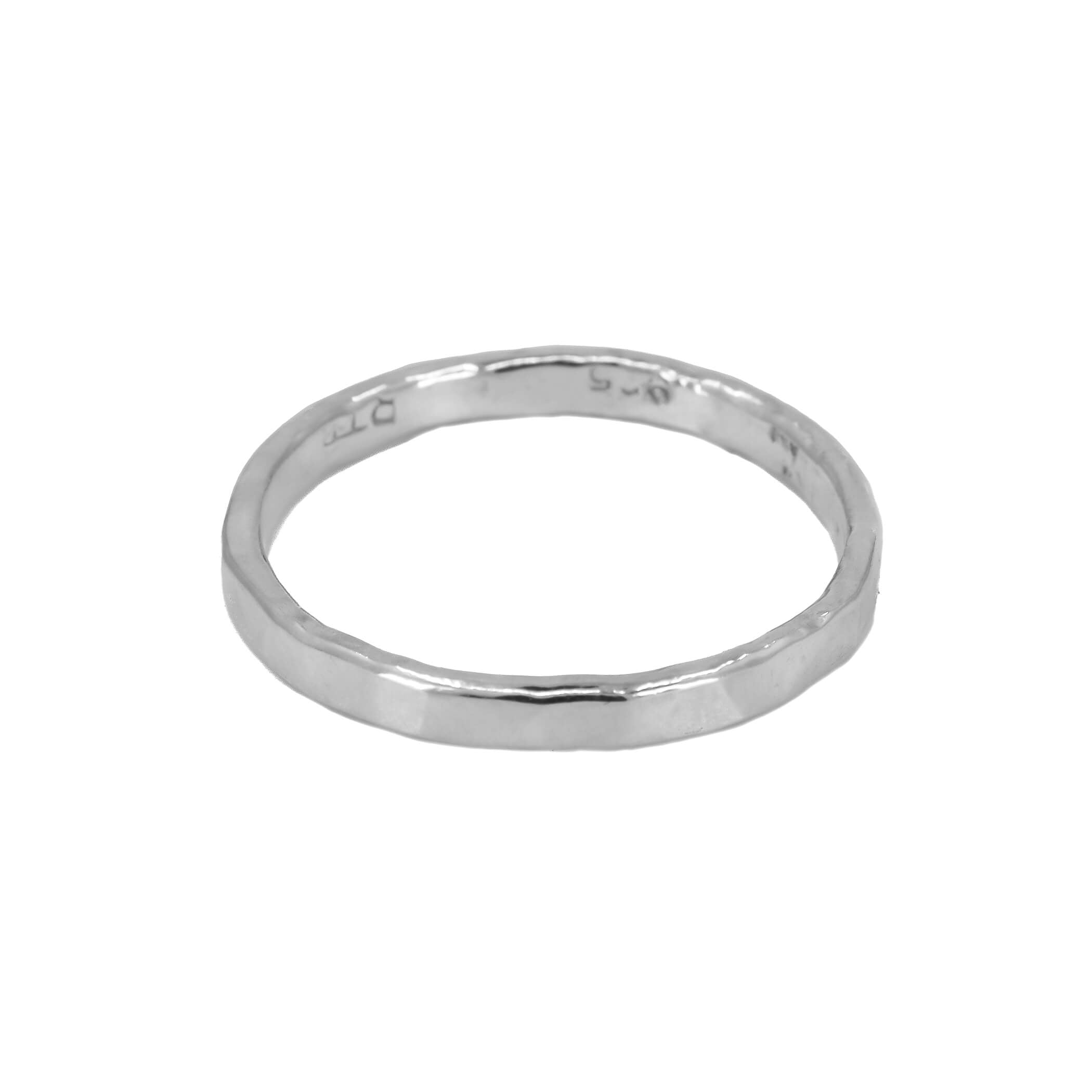 Faceted stacking ring in sterling silver laying down