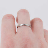 Hammered stacking ring in sterling silver worn on finger