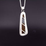 Montana agate sterling silver pendant necklace view of the back with a pierced line design to allow views of the stone.