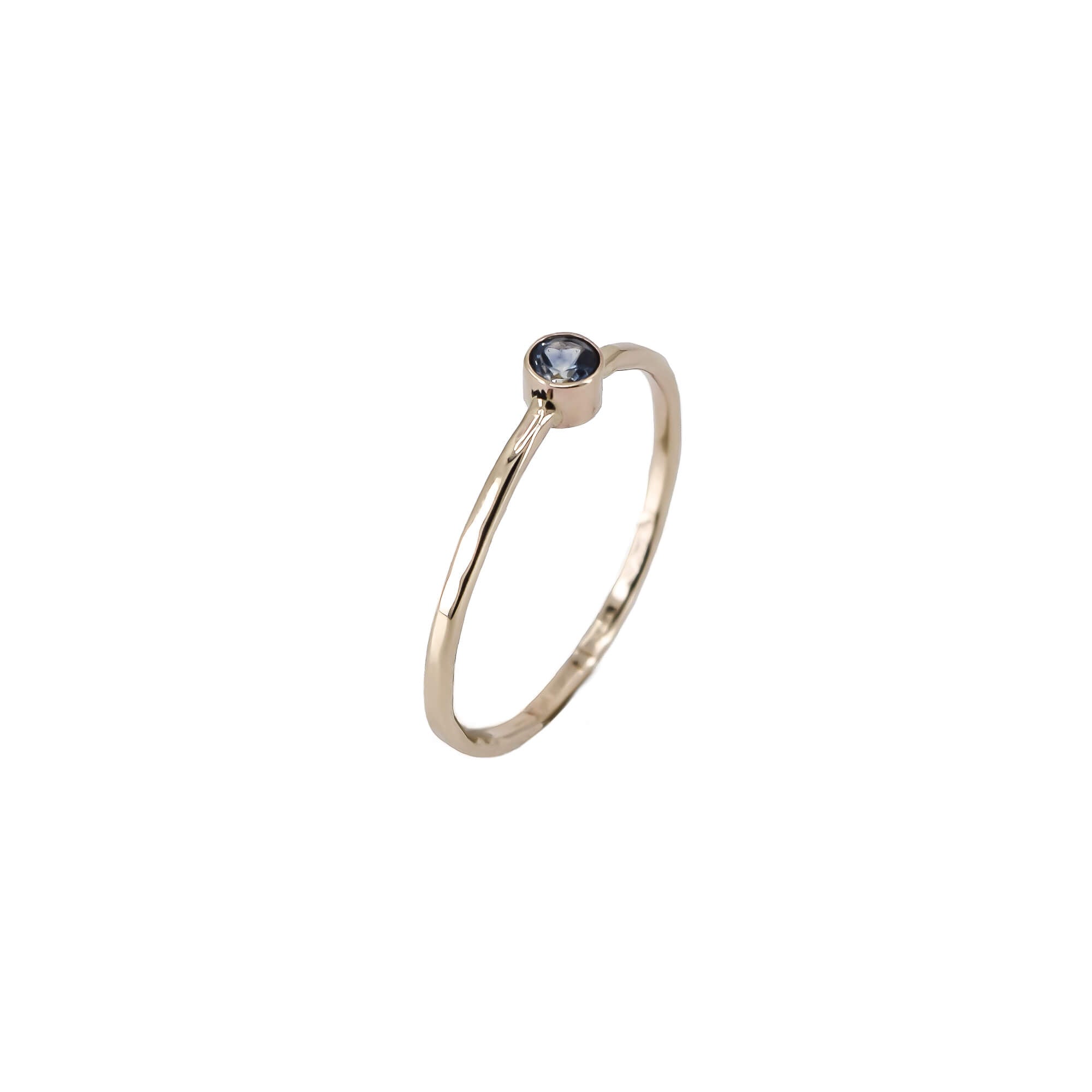 thin 14K yellow gold stacking ring with teal sapphire