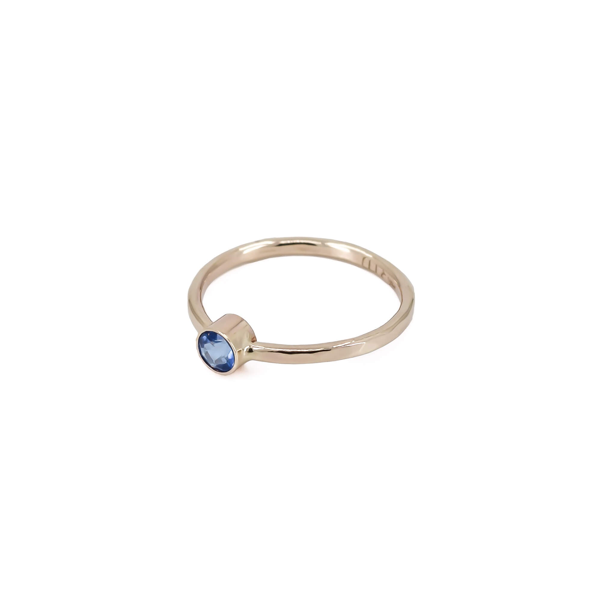 14K yellow gold ring with ice blue topaz faceted stone and faceted band