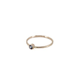 thin 14K yellow gold stacking with with Montant teal sapphire