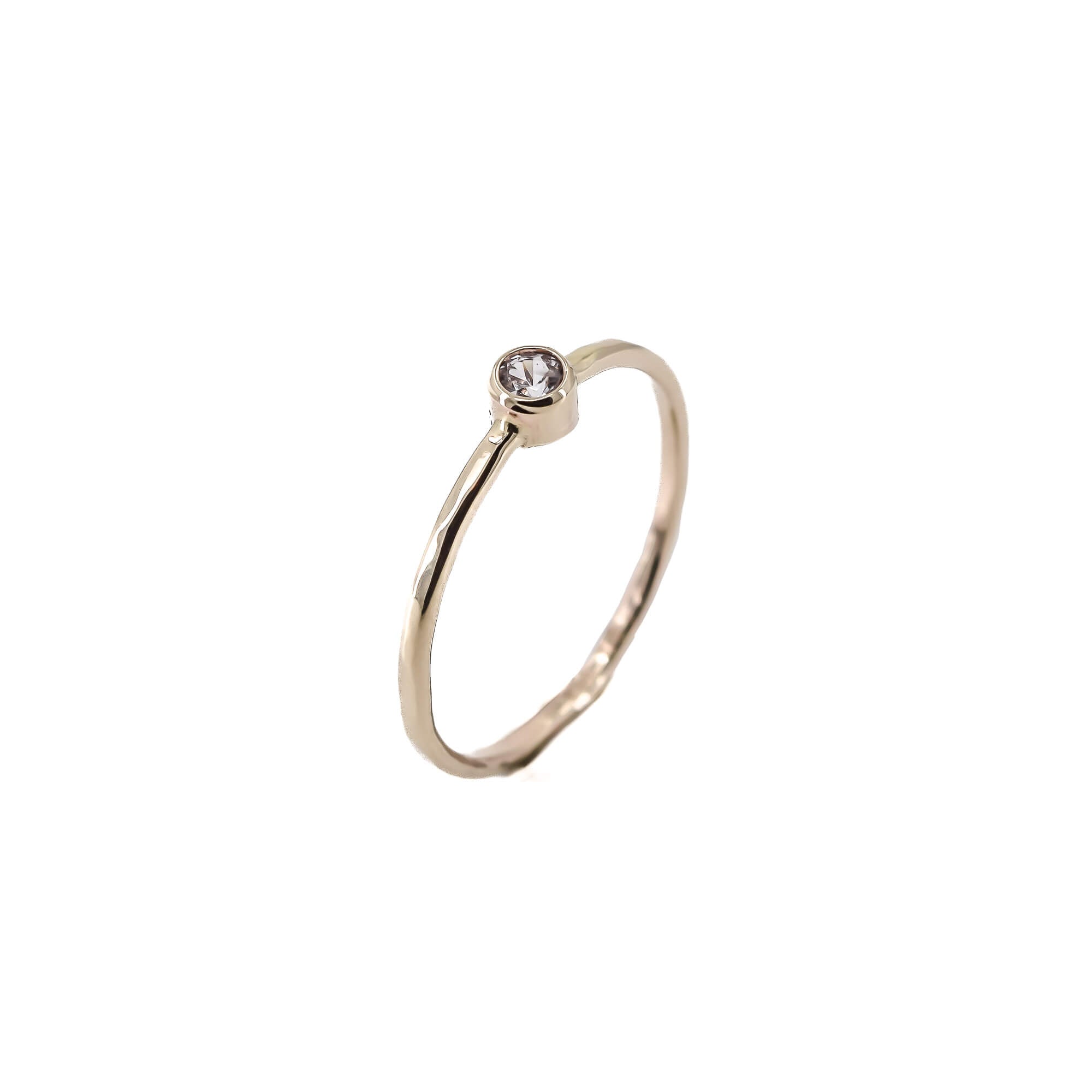 thin 14K yellow gold stacking ring with white sapphire
