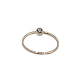 thin, stacking 14K yellow gold ring with white sapphire