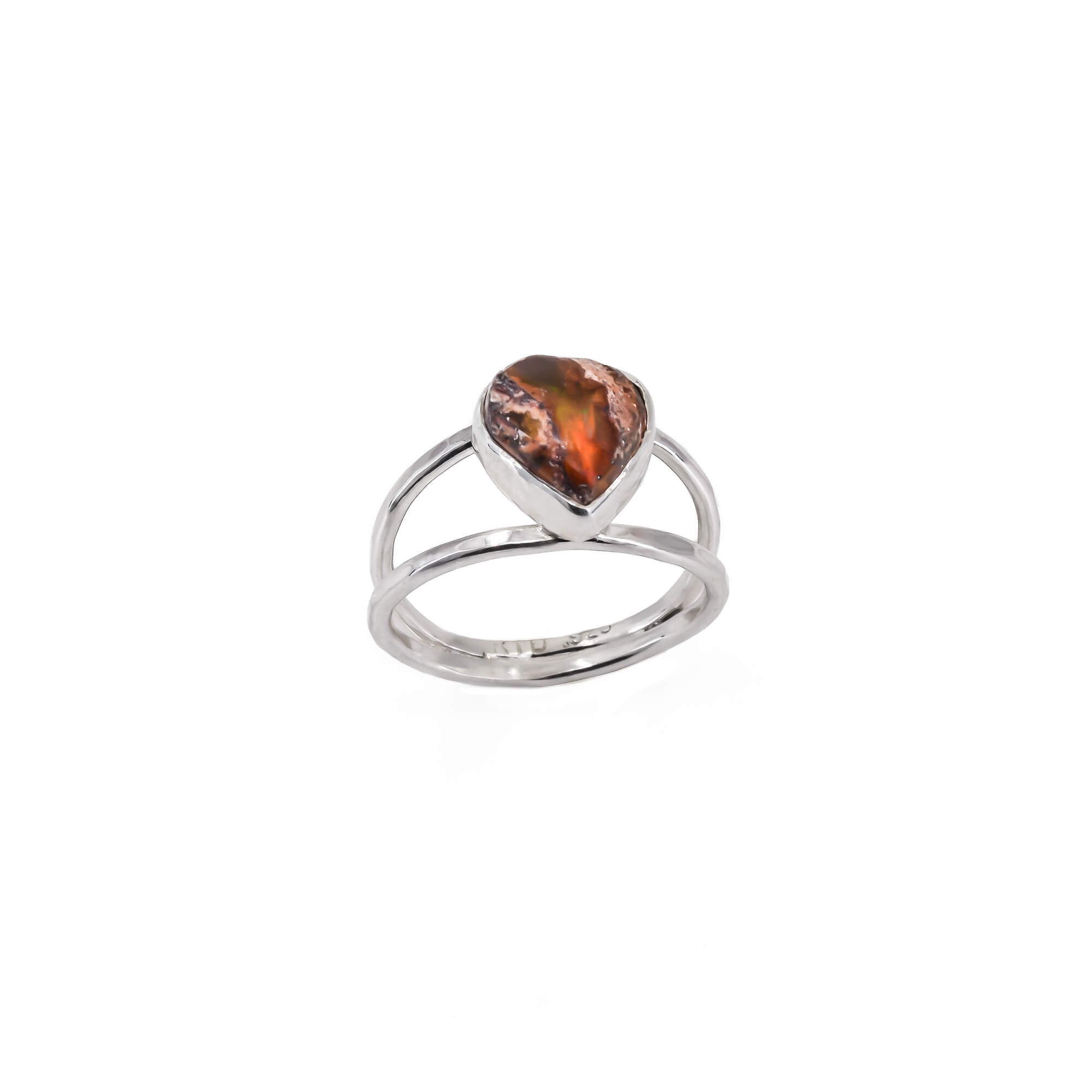 Cantera opal in a heart shape in a sterling silver ring, which has a textured double band.