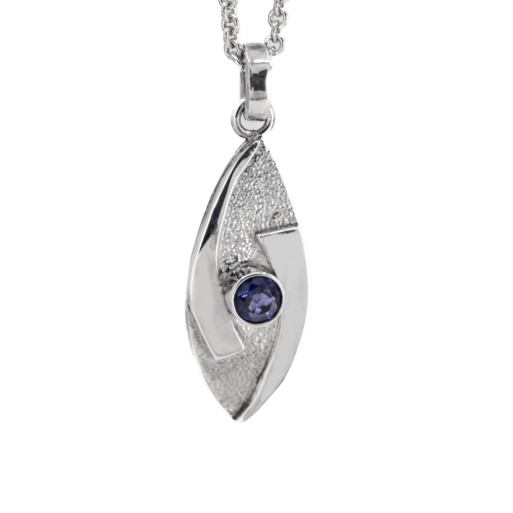 small hugged pendant necklace in sterling silver with a stardust texture and a 4mm Iolite faceted stone