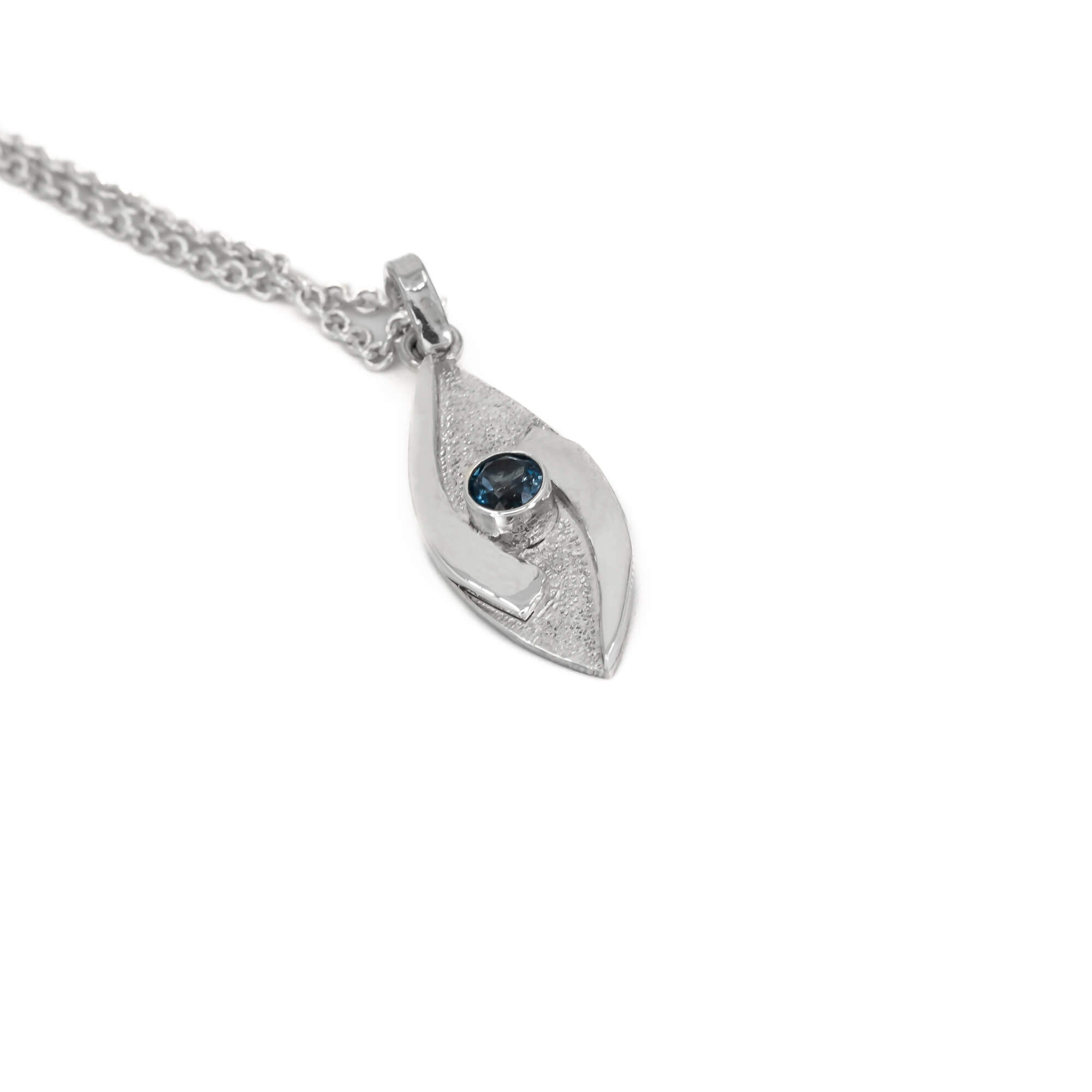 small hugged pendant necklace in sterling silver with a stardust texture and a 4mm London Blue Topaz faceted stone side view