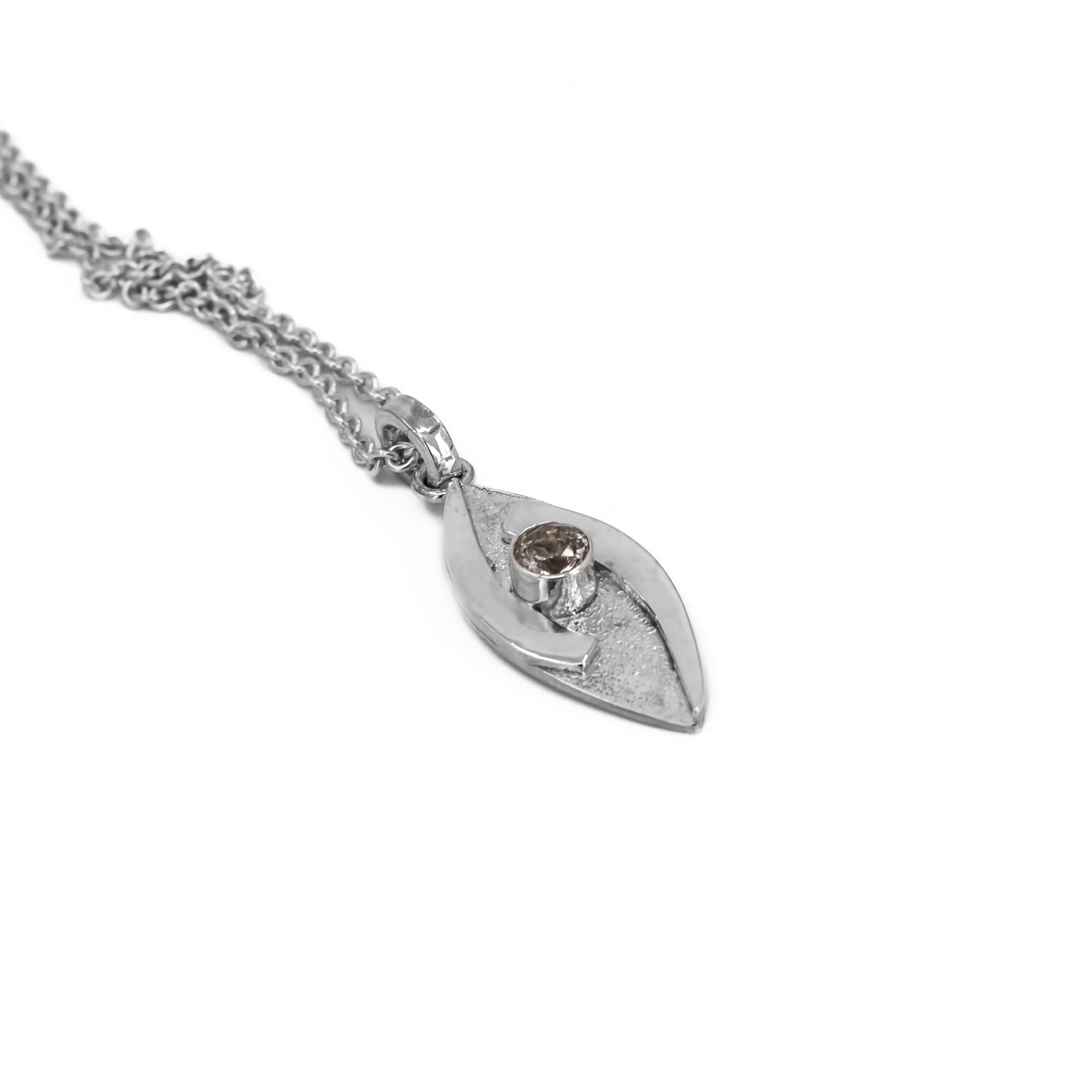 small hugged pendant necklace in sterling silver with a stardust texture and a 4mm Morganite faceted stone side view