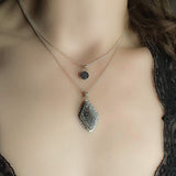 Small black druzy pendant necklace sterling silver  shown on model layered with a diamond shaped grey and black druzy pendant