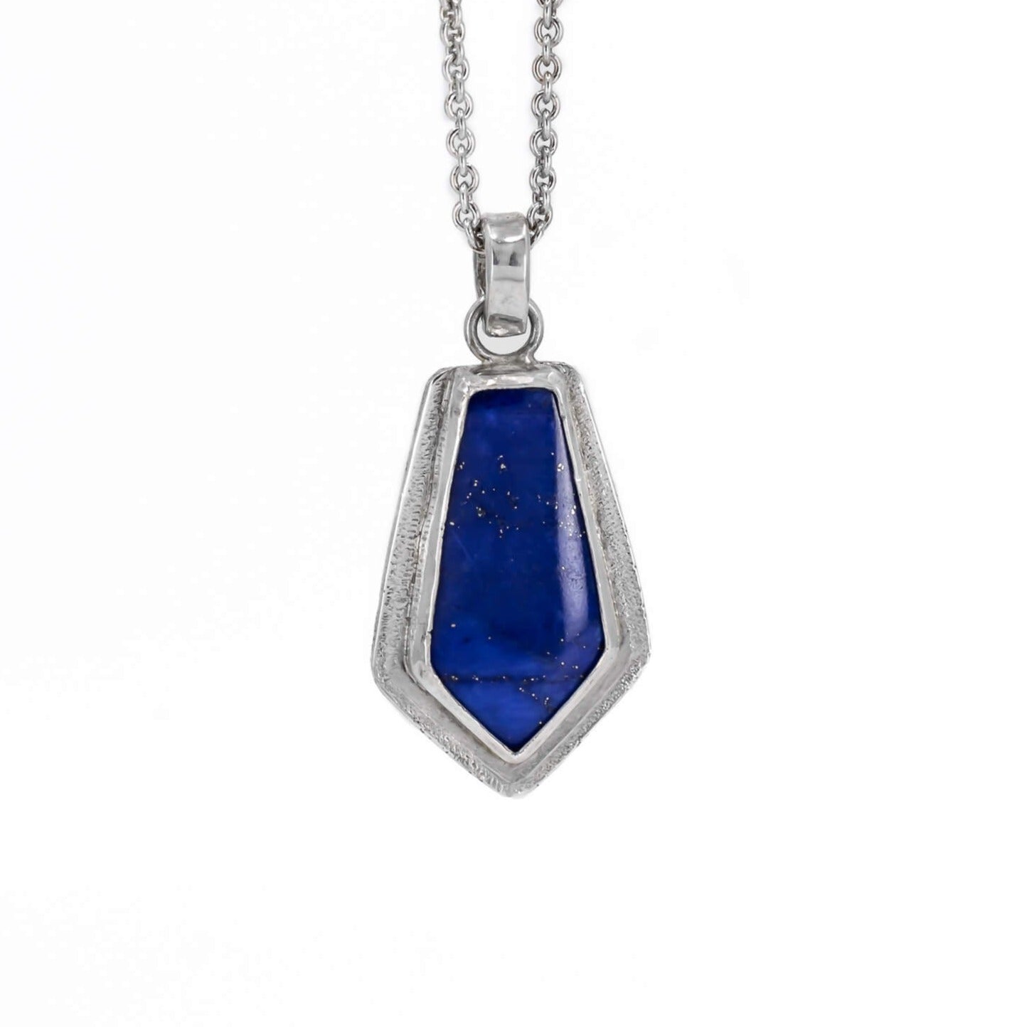 Lapis lazuli kite shaped pendant necklace in sterling silver with a star dust textured border hanging on a cable chain