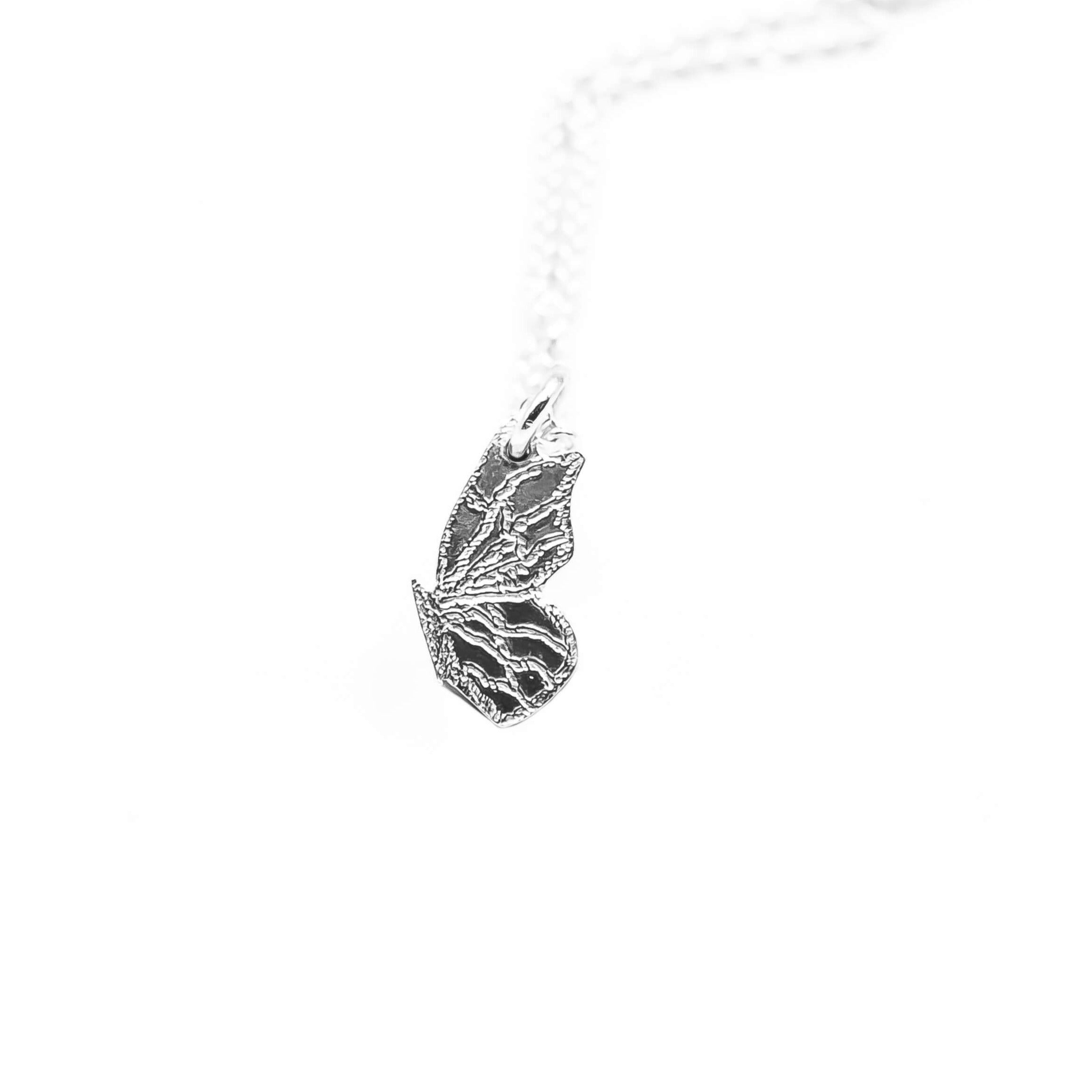 Tiny Sterling silver butterfly pendant
