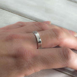 Sterling silver stardust textured ring shown on hand