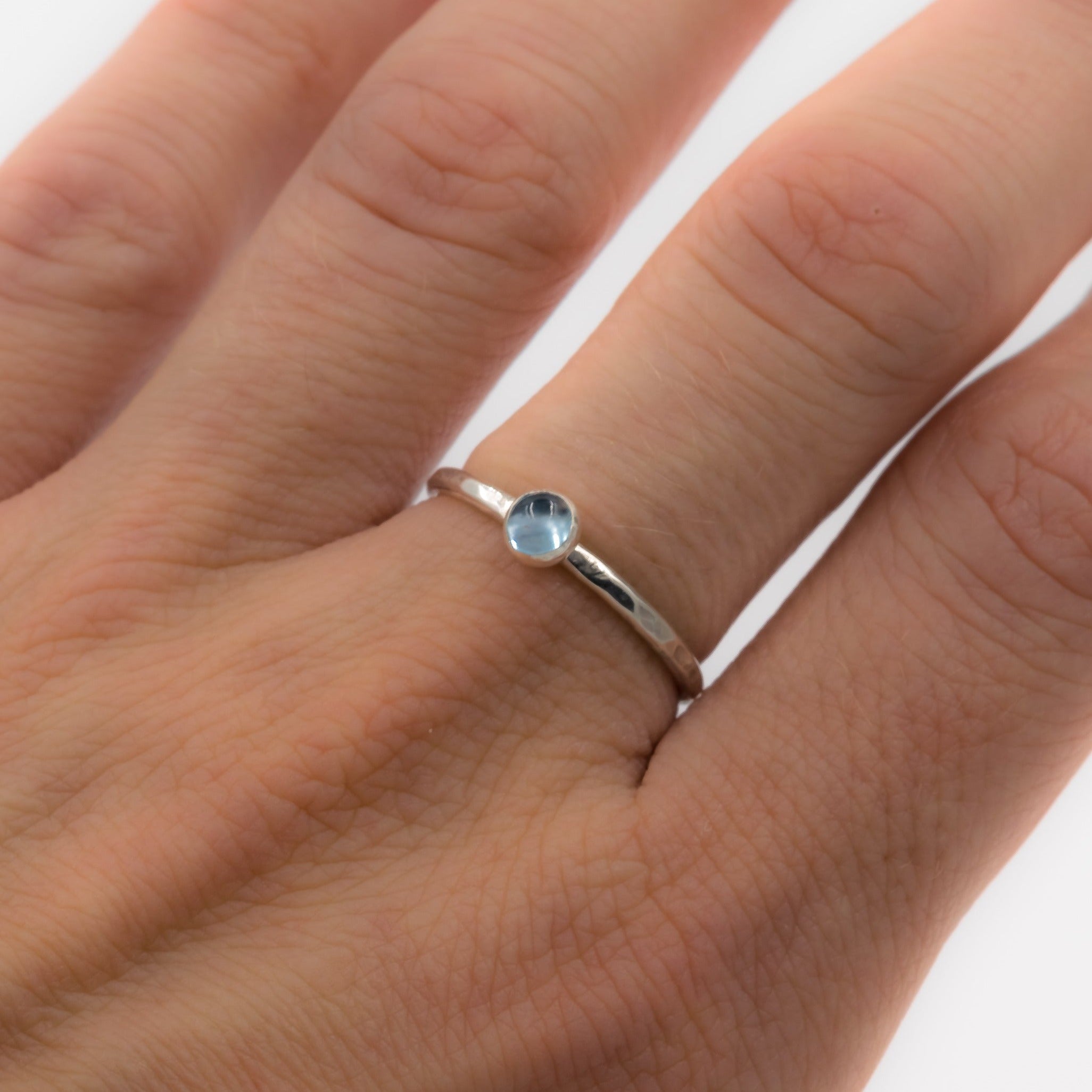 Sterling_silver_swiss_blue_topaz_ring_stackable_on_model