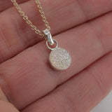 Small white druzy pendant necklace sterling silver  shown in hand for scale