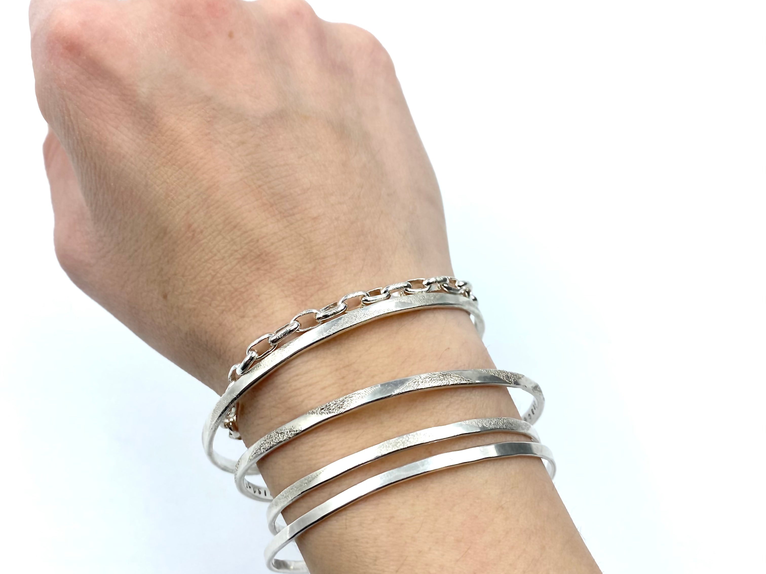 paperclip_sterling_silver_chain_link_bracelet_on_model_stacked